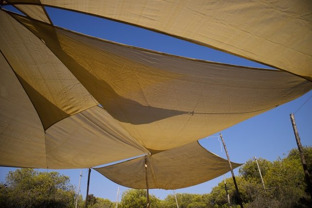 High-quality shade sail cleaned in a Brisbane outdoor area for sun protection