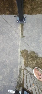 Freshly cleaned concrete pathway after professional pressure washing in Brisbane
