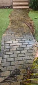 Dirty brick pathway with mould and grime before controlled pressure washing in Brisbane